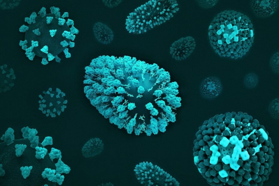 a group of blue and green cells on a black surface